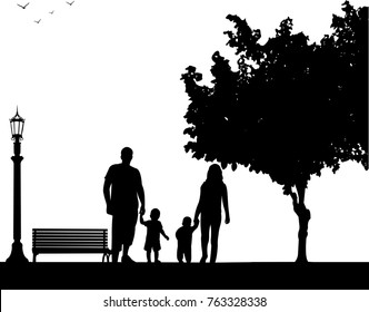 Family walking with their children in park