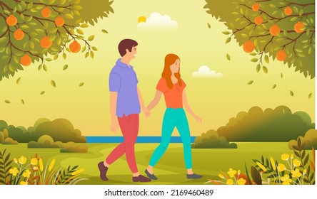 Family walks in city park. Young people in relationship spending time together oudoor. Couple in love walking by handle in forest. Guy and girl communicate and relax in spring or summer garden