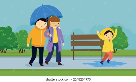 the family walks in the rain and the child jumps through the puddles in rubber boots