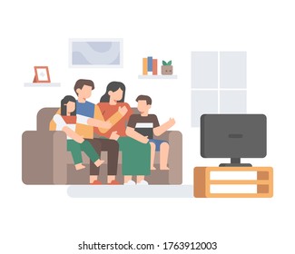 A Family Is Watching TV Together On The Couch