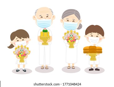 Family wearing face mask and offering to Buddhist with Kathin ceremony