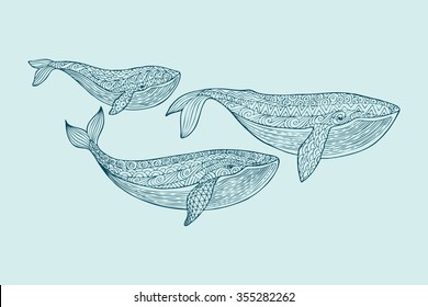 Family whales . Mom, dad and baby whales. Patterned whale silhouette on a blue background. Zentangle stylized set sea animals. Hand Drawn aquatic doodle vector illustration. 