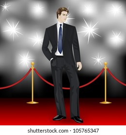 famous  elegant man in suit posing in front of the paparazzi on the red carpet