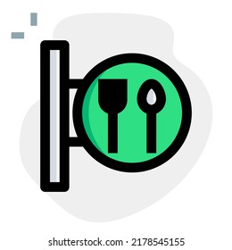 Famous restaurant in the town with kitchenware on banner