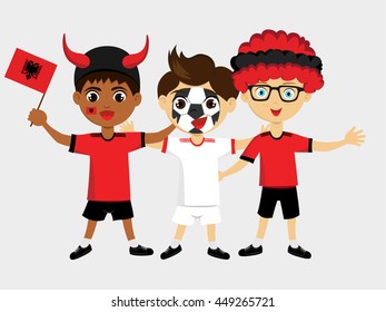 Fan of Albania national football team, sports. Boy with flag in the colors of the national command with sports paraphernalia.