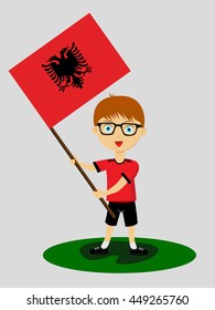 Fan of Albania national football team, sports. Boy with flag in the colors of the national command with sports paraphernalia.