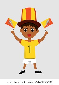 Fan of  Bhutannational football team, sports. Boy with flag in the colors of the national command with sports paraphernalia.