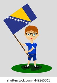 Fan of Bosnia and Herzegovina national football team, sports. Boy with flag in the colors of the national command with sports paraphernalia.