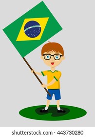 Fan of Brazil national football team, sports. Boy with flag in the colors of the national command with sports paraphernalia.
