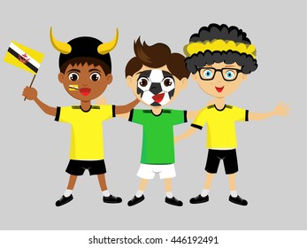 Fan of Brunei national football team, sports. Boy with flag in the colors of the national command with sports paraphernalia.