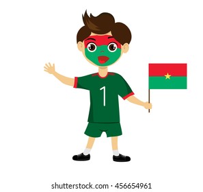 Fan of Burkina Faso national football team, sports. Boy with flag in the colors of the state command with sports paraphernalia.