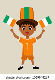 Fan of Cote dIvoire national football, hockey, basketball team, sports. Boy with Cote dIvoire flag in the colors of the national command with sports paraphernalia. Boy with Cote dIvoire flag