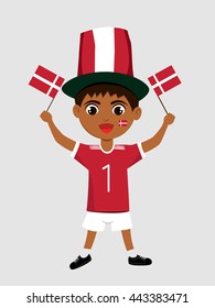 Fan of Denmark national football team, sports. Boy with flags in the colors of the national command with sports paraphernalia