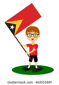 Fan of East Timor national football team, sports. Boy with flag in the colors of the state command with sports paraphernalia.