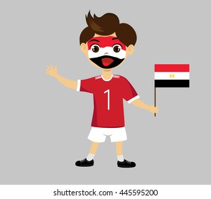 Fan of  Egypt national football team, sports. Boy with flag in the colors of the national command with sports paraphernalia.