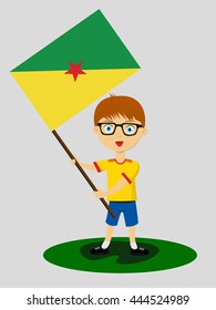 Fan of French Guiana (Guyane) national football team, sports. Boy with flag in the colors of the national command with sports paraphernalia.