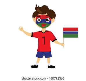 Fan of Gambia national football team, sports. Boy with flag in the colors of the state command with sports paraphernalia.