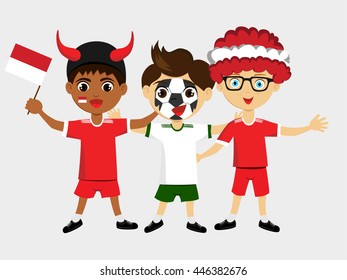 Fan of Indonesia national football team, sports. Boy with flag in the colors of the national command with sports paraphernalia.