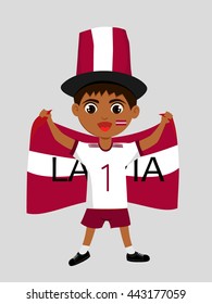 Fan of  Latvia national football team, sports. Boy with flag in the colors of the national command with sports paraphernalia.
