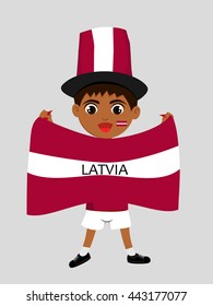Fan of  Latvia national football team, sports. Boy with flag in the colors of the national command with sports paraphernalia.