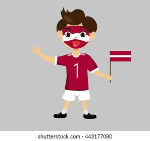 Fan of  Latvia national football team, sports. Boy with flag in the colors of the national command with sports paraphernalia.