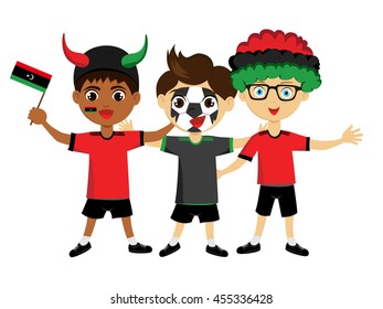 Fan of Libya national football team, sports. Boy with flag in the colors of the state command with sports paraphernalia.
