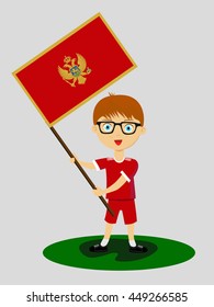 Fan of Montenegro national football team, sports. Boy with flag in the colors of the national command with sports paraphernalia.
