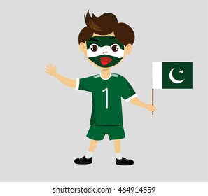 Fan of Pakistan national football team, sports. Boy with flag in the colors of the state command with sports paraphernalia.