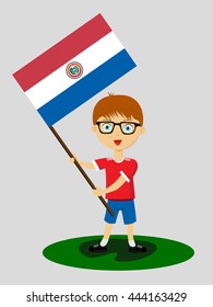Fan of Paraguay national football team, sports. Boy with flag in the colors of the national command with sports paraphernalia.
