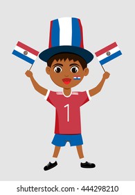 Fan of Paraguay national football team, sports. Boy with flag in the colors of the national command with sports paraphernalia.