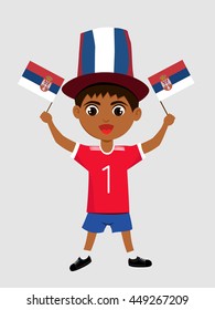 Fan of Serbia national football team, sports. Boy with flag in the colors of the national command with sports paraphernalia.