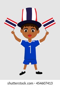 Fan of  Thailand national football team, sports. Boy with flag in the colors of the national command with sports paraphernalia.