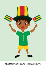 Fan of Togo national football, hockey, basketball team, sports. Boy with Togo flag in the colors of the national command with sports paraphernalia. Boy with Togo flag in the form of a sport.