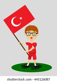 Fan of Turkey national football team, sports. Boy with flag in the colors of the national command with sports paraphernalia.