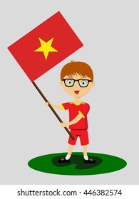 Fan of  Vietnam national football team, sports. Boy with flag in the colors of the national command with sports paraphernalia.