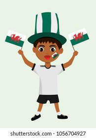 Fan of Wales national football, hockey, basketball team, sports. Boy with Wales flag in the colors of the national command with sports paraphernalia. Boy with Wales flag in the form of a sport.