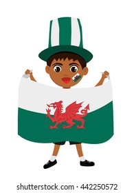 Fan of Wales national football team, sports. Boy with flag in the colors of the national command with sports paraphernalia. 