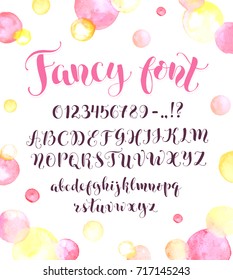 Fancy calligraphy font with watercolor spots isolated on background. Uppercase, lowercase letters, numbers and symbols. Hand drawn modern script. Beautiful modern alphabet.