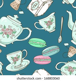 Fancy seamless pattern of blue porcelain tea set and French macaroons