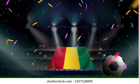 Fans hold the flag of Guinea among silhouette of crowd audience in soccer stadium with confetti to celebrate football game. Concept design for football result template