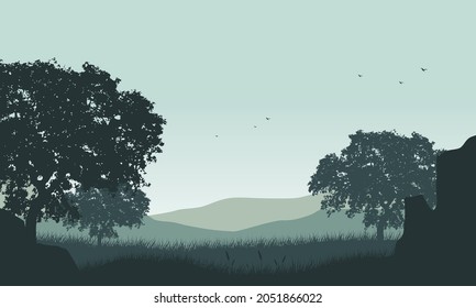 Fantastic Panorama of the mountains in the morning with the silhouette of grass and shady trees around it. Vector illustration of a city