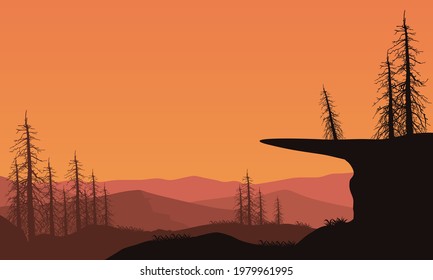 A fantastic panoramic view of the silhouettes of mountains and dry trees at dusk. Vector illustration of a city