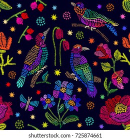 Fantasy floral embroidery inspired by folk art. Seamless vector pattern with birds, berries, butterflies and flowers. Vintage motifs. Retro textile design collection. Colorful on dark.