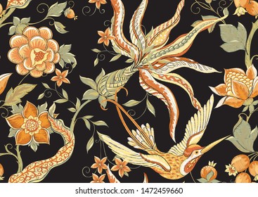 Fantasy flowers, traditional Jacobean embroidery style. Seamless pattern, background. Embroidery imitation. Vector illustration in soft orange and green colors isolated on black background.