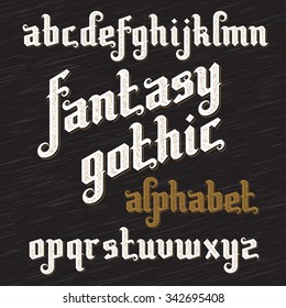 Fantasy Gothic Font. Retro vintage alphabet. Custom gothic type letters on dark background. Stock vector typography