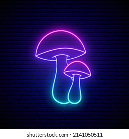 Fantasy luminous mushrooms in neon style. Glowing fungus on dark brick wall background. Fairy tale mushrooms with luminous blue and purple color gradient.