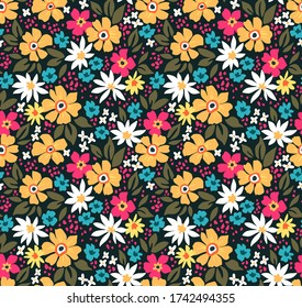 Fantasy seamless floral pattern with colorful flowers and leaves on a black background. The elegant the template for fashion prints. Modern floral background.