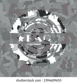 FAQ written on a grey camouflage texture