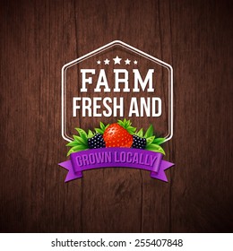 Farm Fresh and Grown Locally vector illustration on a rustic wood background with a hexagonal frame and banner decorated with a strawberry and blackberry