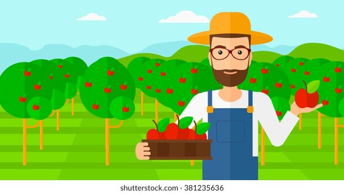 Agricultor recogiendo manzanas.